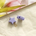 Detail view of a 10mm lavender star bead with center hole on a gold pin for DIY jewelry - 1 Piece / Purple