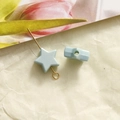 Macro detail of a 10mm light blue matte star bead with a pre-drilled hole for DIY jewelry - 1 Piece / Blue