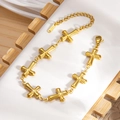 Goldenes Edelstahl-Kettenarmband für Damen mit mehreren polierten Kreuzanhängern - Kreuzform (sl092g)