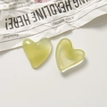 Close-up of heart-shaped light green translucent resin charms with ink-wash texture effect - Grass Green
