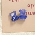 Detailed macro view of two blue resin bears with sequins on minimalist art card background - Klein Blue (Cloud Pattern)