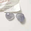 Macro shot of smoky grey heart resin pendants with white marble texture for DIY jewelry - Grey Purple