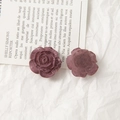 Detailed view of dark red acrylic rose charms with vintage cracked paint texture effect - Deep Purple