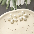 Close-up of pearlized white five-petal flower resin charms for DIY jewelry making - Imitation Shell Five-Petal Flower / 2 Pcs/Set / Pearl White