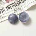 Detailed close-up of semi-round resin charms with dark purple marble texture - Semicircle / Grey Purple