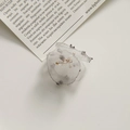 Detail of delicate off-white mesh fabric flower with gold bead center and petal texture - Off-White