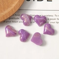 Detail view of purple marble resin heart charms with gold flakes for DIY jewelry - Rose Purple