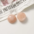 Detail of pink marble resin charms with warm amber swirls for DIY jewelry making - Semicircle / Pink