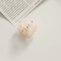Detailed close-up of light champagne organza petal earrings with gold beads and mesh layers - Apricot