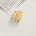 Detailed macro view of delicate golden mesh flower petals with pearl center for DIY crafts - Gold