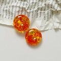 Detail view of 20mm amber resin charms with red foil inclusions on vintage paper - 1 Piece / Gold Red