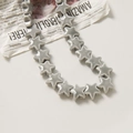 Detailed view of glossy dark grey ceramic star beads for DIY jewelry and crafts - Glossy Dark Gray (55#) / 1 Piece Pack