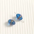 Macro detail of oval blue glass beads with gold glitter and 3D floral accents - Olive Shape (97#) / 1 Piece / Blue