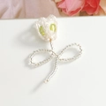 Detailed view of handmade beaded tulip flower charms in white and soft green acrylic - Green