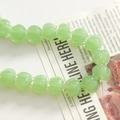 Macro shot of translucent light green pumpkin shaped resin beads for jewelry making - Light Green