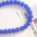 Close-up of royal blue lily of the valley glass beads for DIY jewelry making - Dark Blue