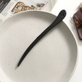 Detailed close-up of a vintage black ebony hair stick with elegant flower hollow carving - Six-Petal Flower Hollow Style (7)