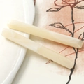Detail showing two rectangular marble pattern resin hair clips on elegant background - 1 Piece / Beige