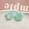 Close-up of mint green resin rose charms with glitter for DIY jewelry making - Mint Green