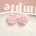 Macro shot of translucent pink resin rose petals with colorful glitter for DIY jewelry - Pink