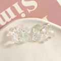 Close-up of translucent iridescent resin flower charms for jewelry and DIY crafts - 1 Piece / AB White