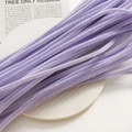 Close-up of lavender purple velvet DIY craft stems arranged on a white ceramic plate - Light Purple