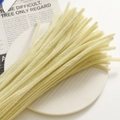 Close-up of soft velvet chenille stems for DIY jewelry making on white ceramic plate - Light Yellow