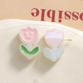 Macro detail of acrylic tulip flower beads for DIY jewelry making in pink and pearl white - Pink
