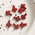 Macro shot of red cross spacer beads with vintage texture for DIY jewelry making - Cross / 1 Piece / Red
