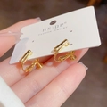 Close-up of gold screw-back clip-on earrings with a minimalist cylindrical metal design - Pattern 3 (Cylindrical) / Gold