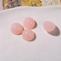 Macro detail of four pink resin cabochons with jelly texture for DIY jewelry making - Pink