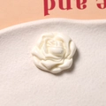 Macro shot of creamy white resin rose charm with 3D petals for DIY accessories - Rose Shape