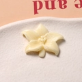 Detail of cream resin lily flower charm with embossed petals for DIY craft accessories - Narcissus Shape
