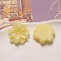 Macro shot of light yellow resin gardenia flower charms for DIY handmade crafts - Yellow
