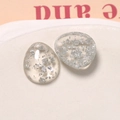 Detailed close-up of water drop resin charms with silver foil for DIY jewelry making - Transparent Silver Foil