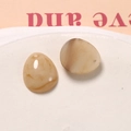Detailed view of teardrop resin charms with marble ink pattern for DIY earring making - Light Coffee