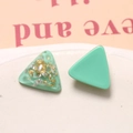 Macro shot of triangle mint green earrings with embedded gold and silver foil details - Lake Green