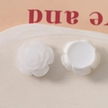 Close-up of white 19mm resin rose charm showing 3D petals and flatback base for DIY craft - White