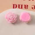 Macro detail of 19mm pink resin rose charm with a flat back for DIY phone case crafts - Pink