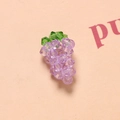 Macro view of handmade 3D crystal grape pendant with faceted lavender beads and green leaf - Light Purple