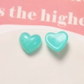 Macro detail of heart-shaped resin charms with smoky blue shimmer and pearlescent finish - Blue