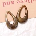 Detailed view of amber marble texture resin teardrop pendants with smooth finish - Milk Coffee