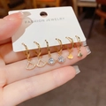 Set van drie paar vergulde waaiervormige oorbellen met glinsterende zirkoonaccenten - Waaier Vorm Stijl (Nr. 40) / 3 paar set / Goud