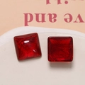 Detailed macro view of square red resin cabochons with golden silk texture for DIY - 1 Piece / Red