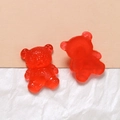 Macro view of a red translucent resin bear with detailed fur texture for DIY crafts - Red