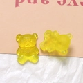 Detailed close-up of lemon yellow resin bear charms with matte and jelly textures - Yellow