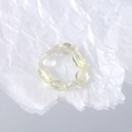 Macro shot of oval translucent yellow gemstone beads on an elastic minimalist ring - Transparent White (One Piece) / White