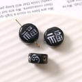 Detail of black glass beads with white Fu character and gold pin for DIY jewelry making - Blessing Character (Fu)