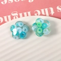 Light blue translucent resin flower charms with glitter sequins for DIY crafts - Blue