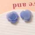 Macro detail of purple resin rose charms with flat back for DIY jewelry and crafts - Blue Purple
